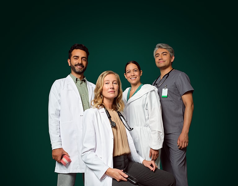 Health care professionals posing in uniform.